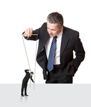 Businessman with another businessman on puppet strings