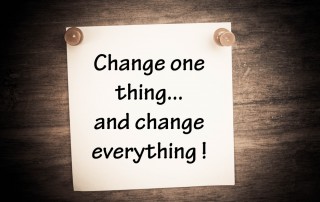 Flipchart with words: change one thing and change everything!