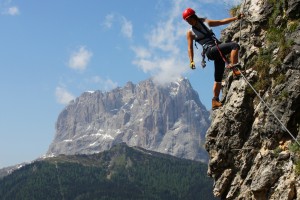 image of a female mountain climber leading her team