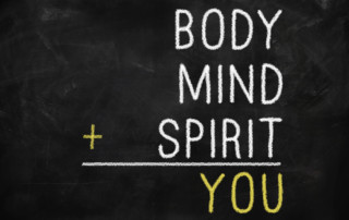 Chalkboard that reads: Body, Mind, plus Spirit equals You