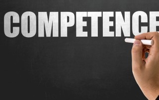 The word "competence" on a blackboard