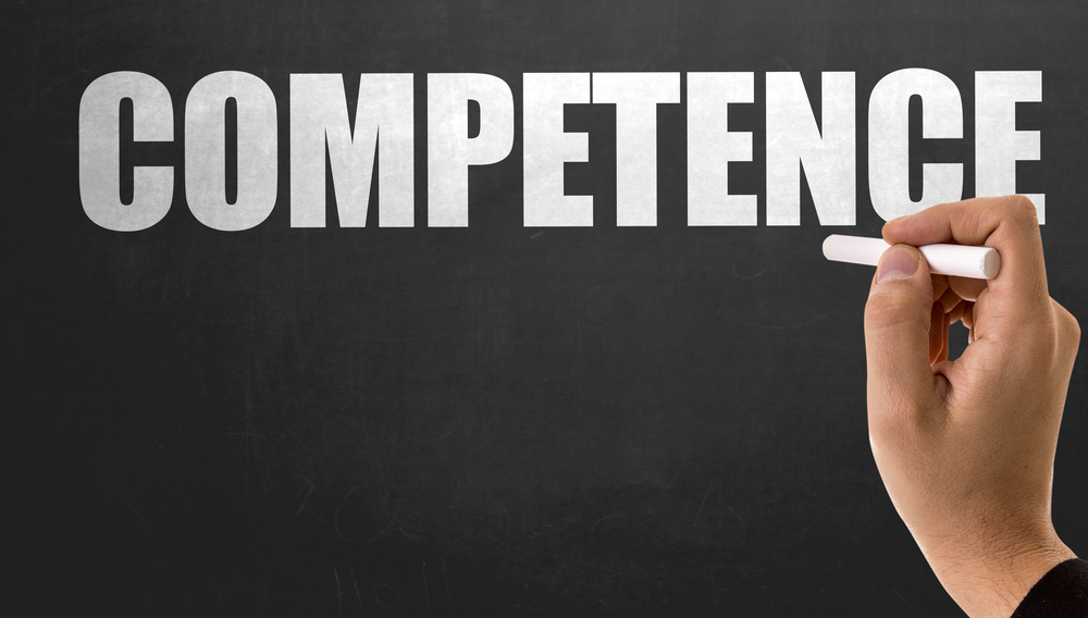 The word "competence" on a blackboard