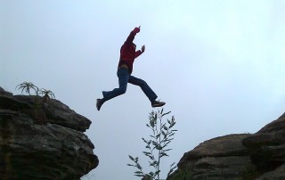 Person Leaping Across Gap