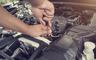 mechanic fixing a car engine