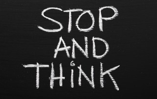 stop and think on chalkboard