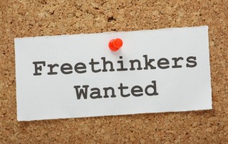 Note on bulletin board that says: Freethinkers Wanted