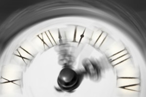 A blurred clock face connoting the passage of time