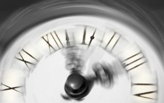 A blurred clock face connoting the passage of time