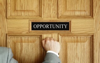 Person knocking on a door where the sign says: Opportunity"
