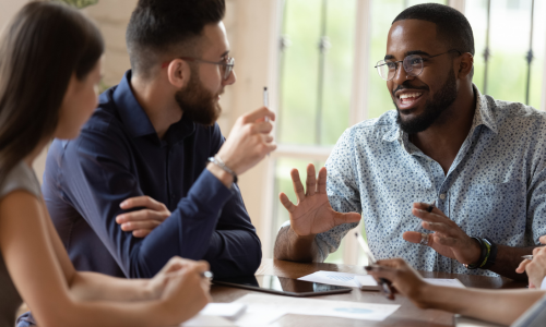 Image of person striving to push a large rock and straining